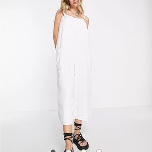 ASOS DESIGN cami minimal pocket jumpsuit in white.